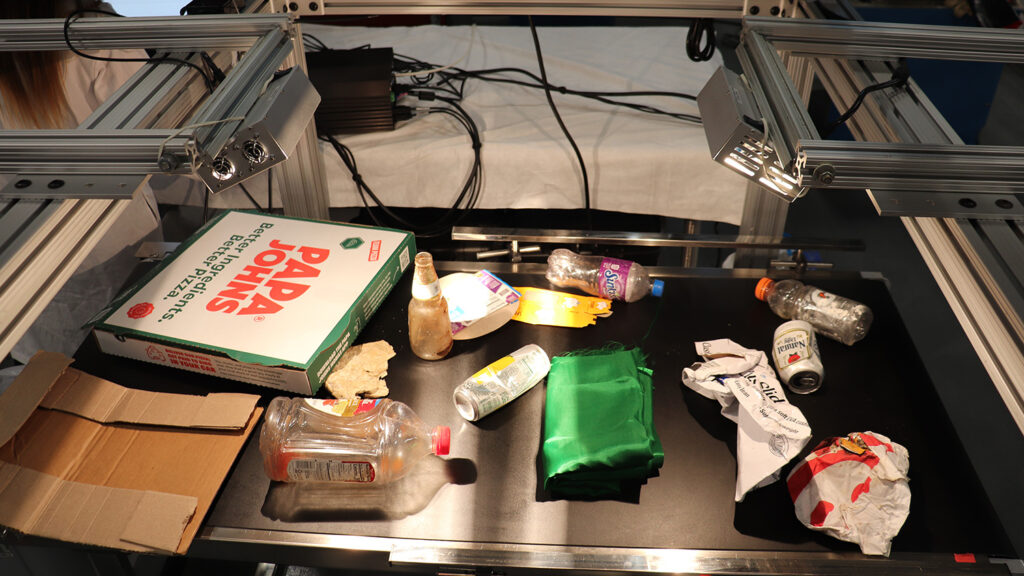 Waste items on a conveyor belt.