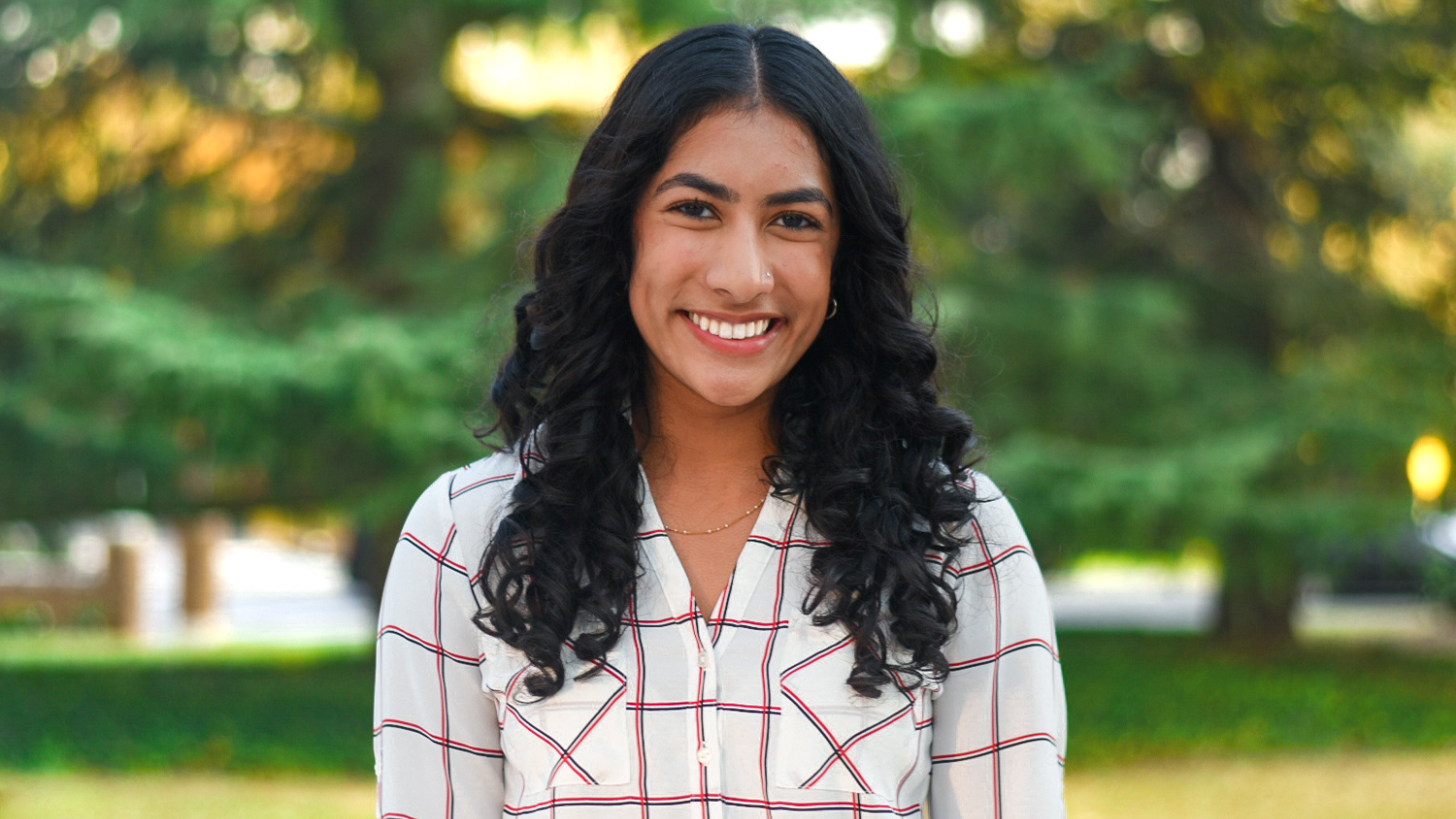 Niveda poses outdoors - Freshman Niveda Mahesh Makes a Lasting change in Her Community and Beyond - College of Natural Resources News NC State University