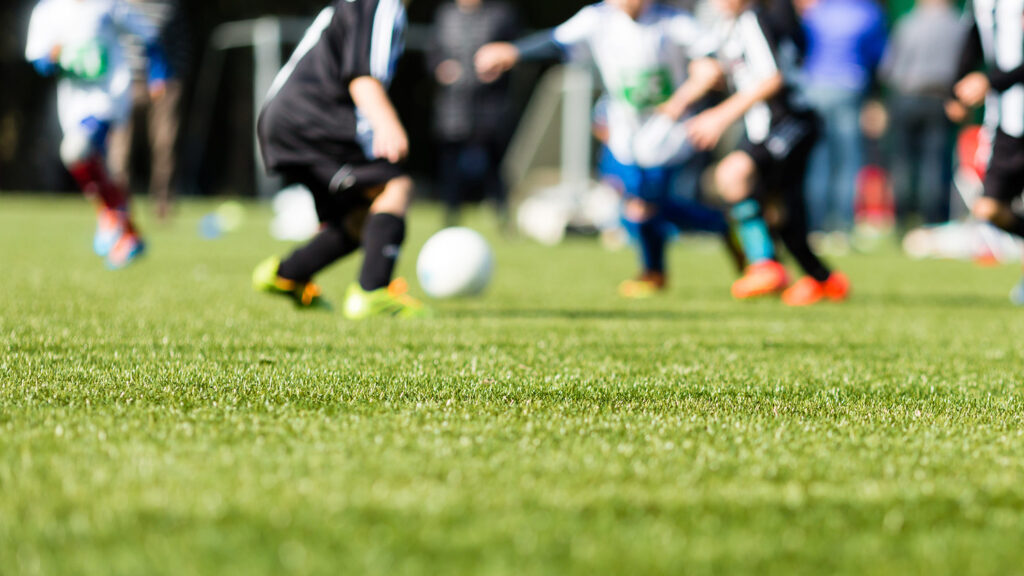 Picture of kids soccer training match with shallow depth of field.