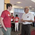 A donors talks with a student