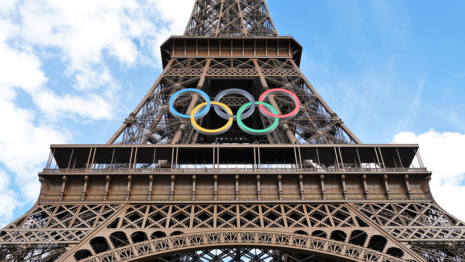 The Eiffel Tower with the logo of the Olympic Games.