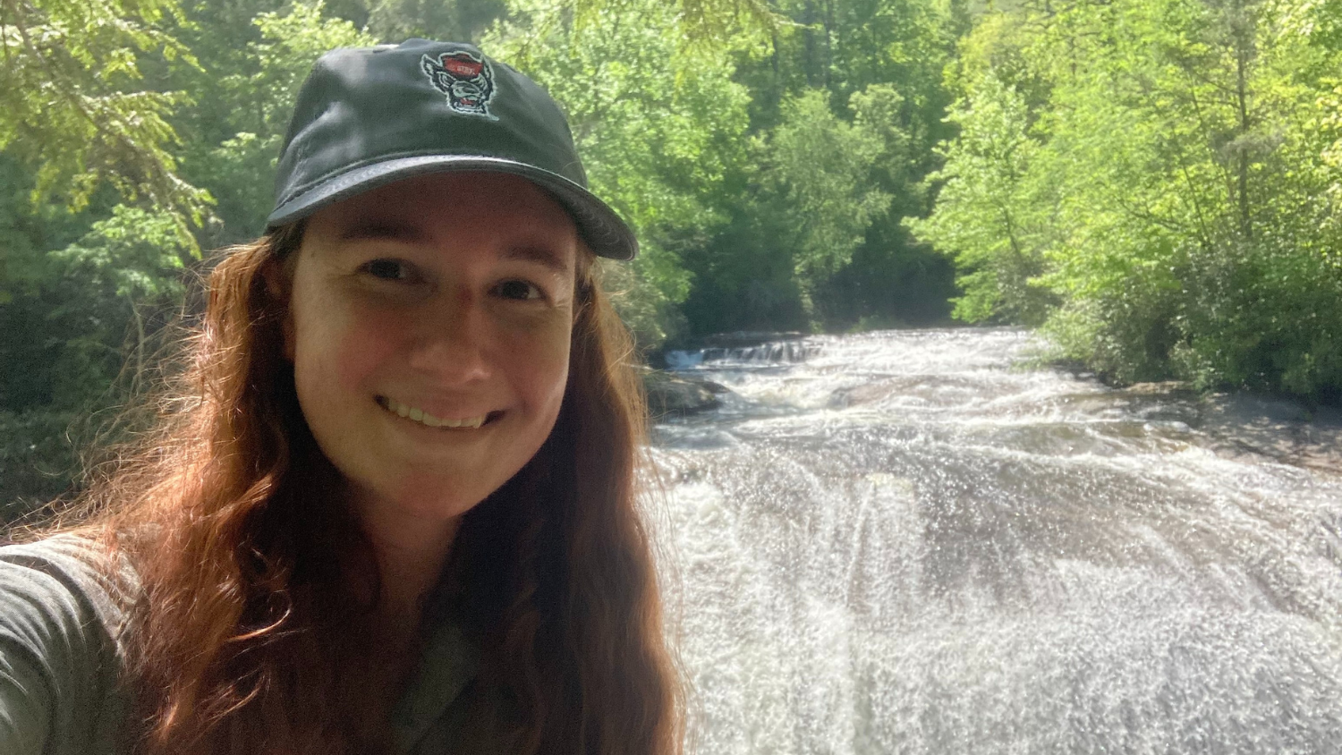 Caitlin poses by rapids