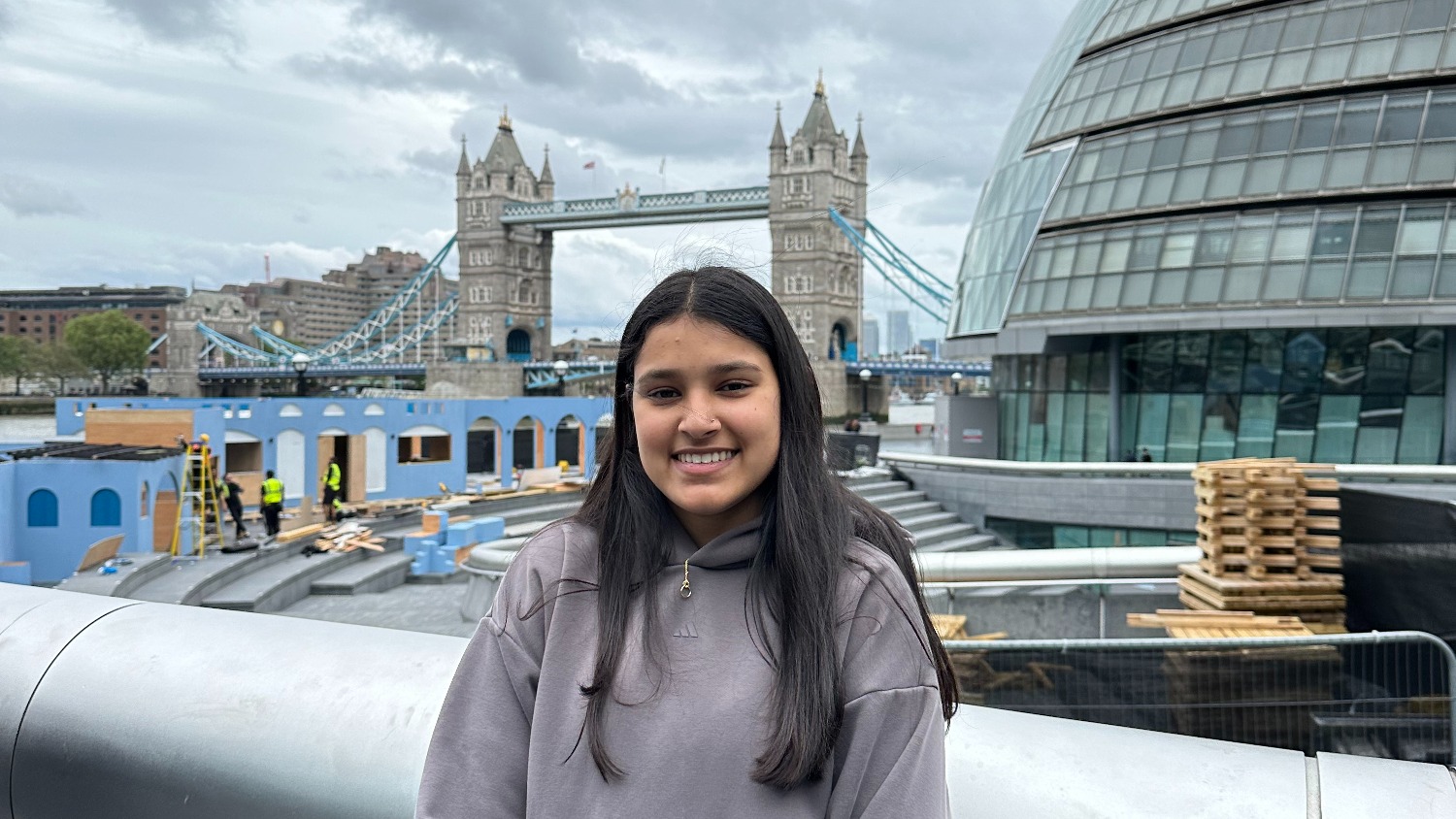 Anika Shah standing in front of Tower Bridge in London, United Kingdom.