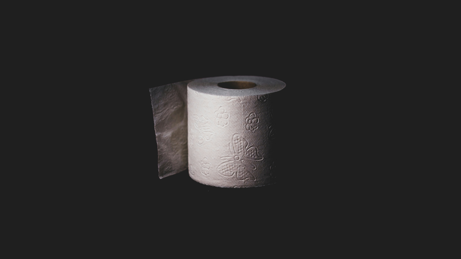 White tissue role on black background.