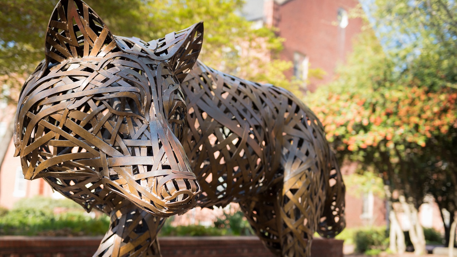 A metal sculpture of a wolf.