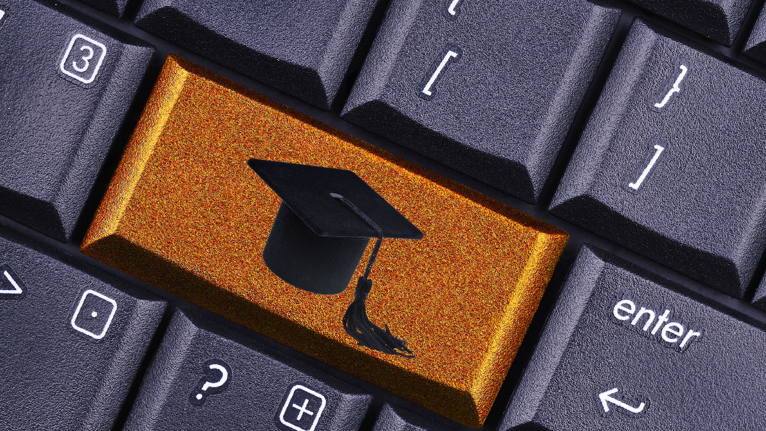 Computer Keyboard with Grad Hat on Button