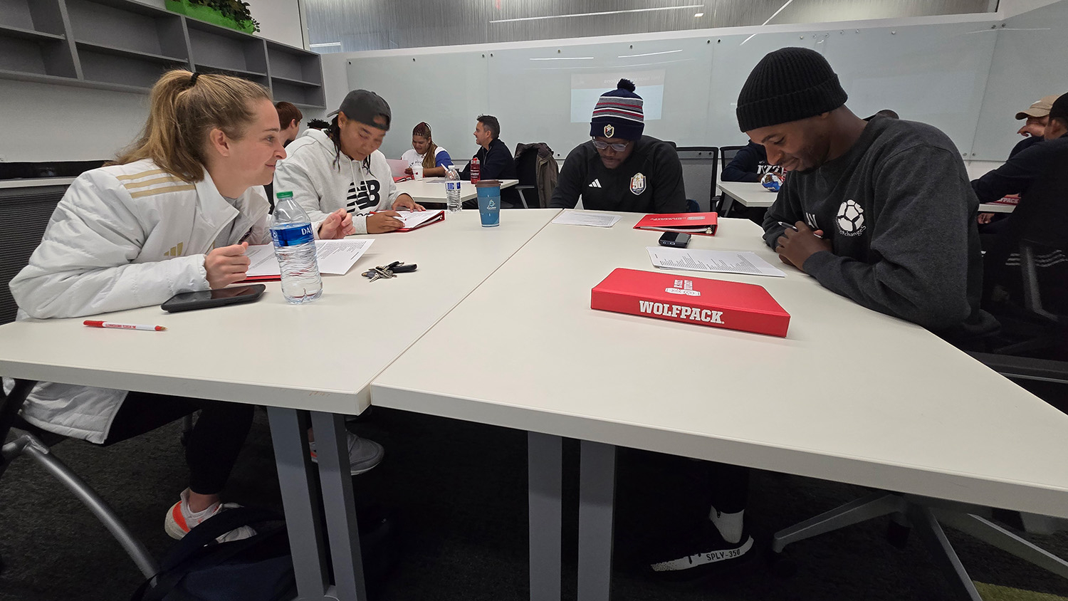 A group of people sitting at a table - Exchange Program Promotes Positive Youth Development Through Sports - Parks, Recreation and Tourism Management at NC State University