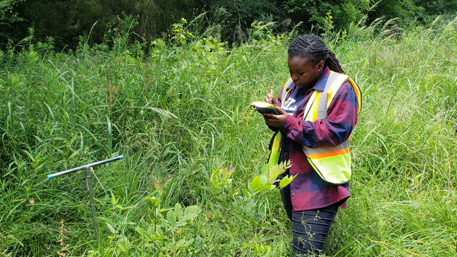 Neverson works in the field outside - Graduation to Vocation: Enhancing the Environment - College of Natural Resources at NC State University