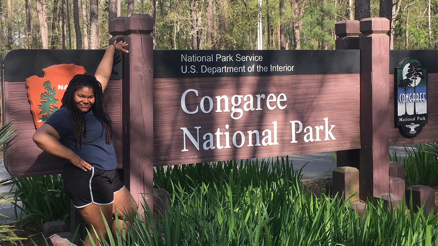 Roslynn poses in front of Congaree National Park sign