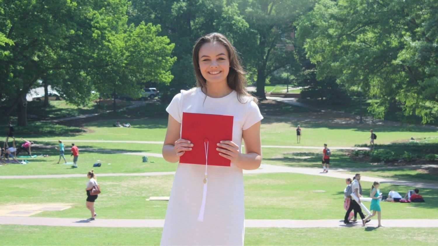 Student Holding a Cap - Five Questions with Climate and Clean Energy Program Assistant Clare Morganelli, College of Natural Resources, Clare Morganelli, feature - College of Natural Resources at NC State