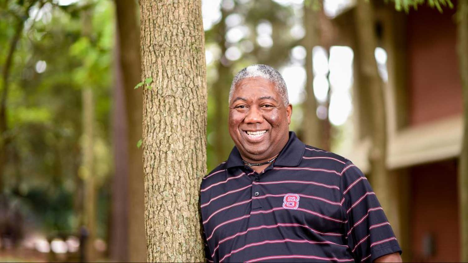 Sam Cook poses by tree - Sam Cook Named Distinguished Alumnus of the Year - College of Natural Resources at NC State University