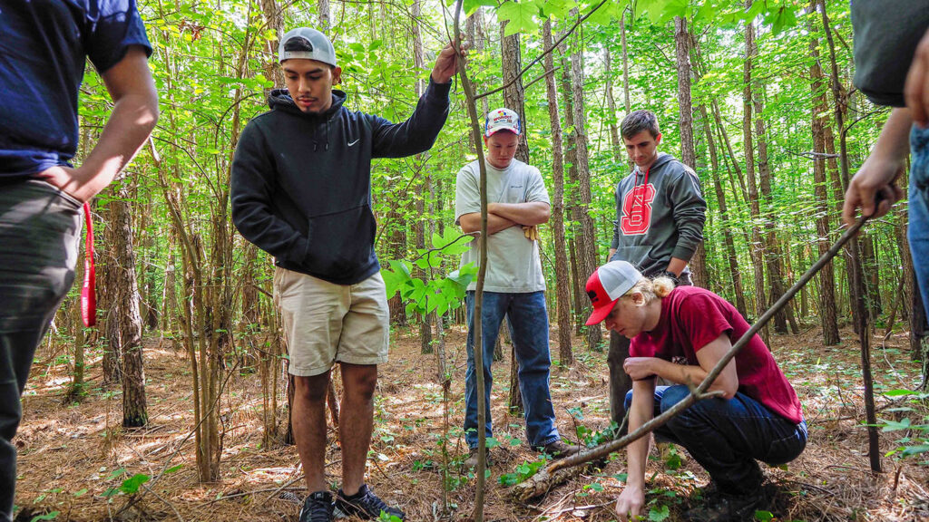 Students in a forest - The Planet is Our Classroom - College of Natural Resources News NC State University
