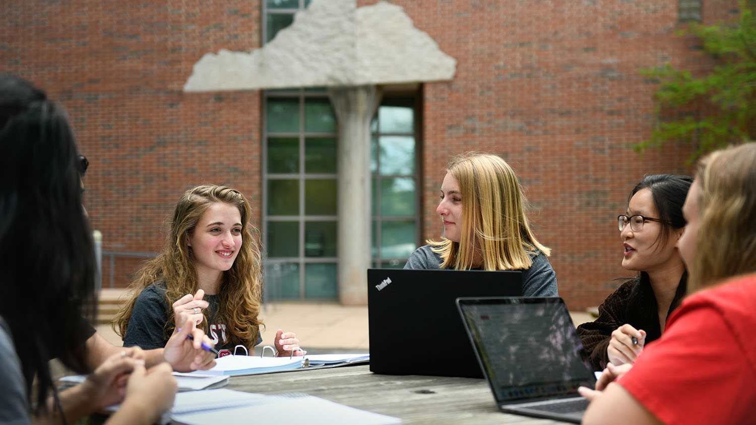 Students outside Jordan Hall at a table  - College of Natural Resources News NC&#160;State University