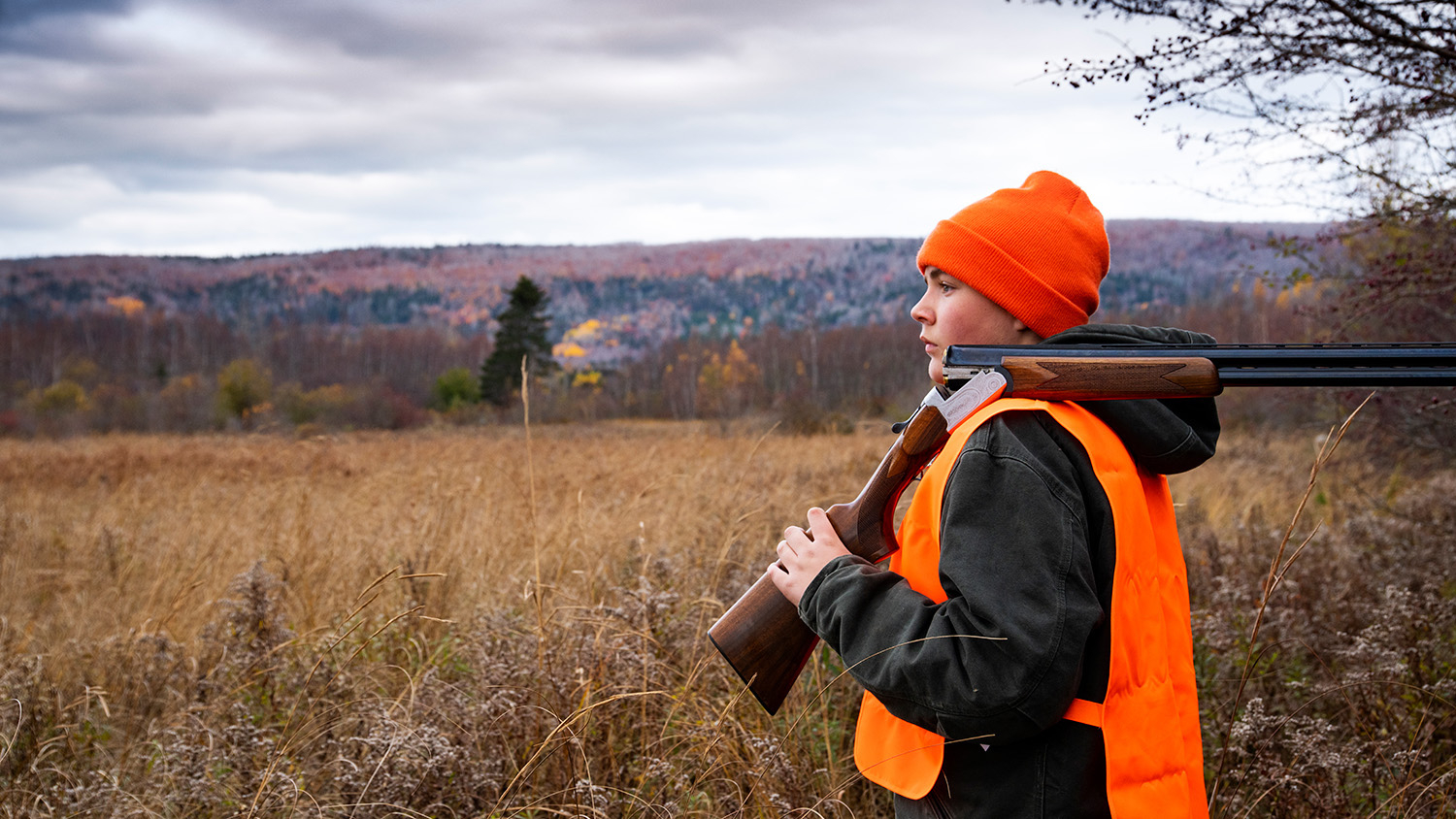 A hunter standing in a field - Experts Share Strategies for Recruiting Hunters on College Campuses - College of Natural Resources at NC State University