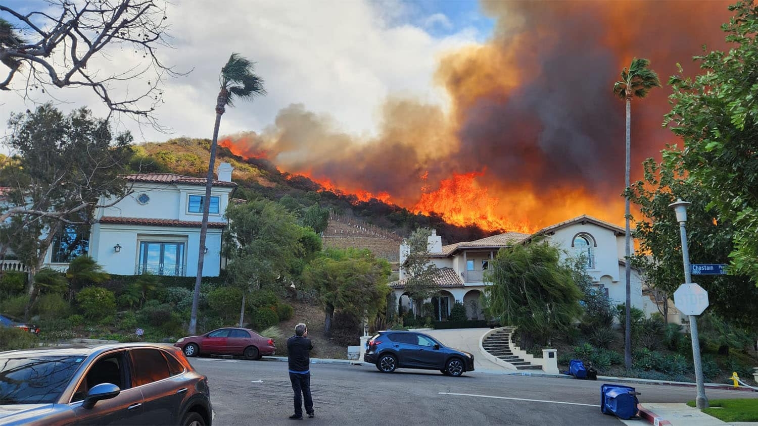 Wildfires rage through Jim Yocum's neighborhood in the Palisades.