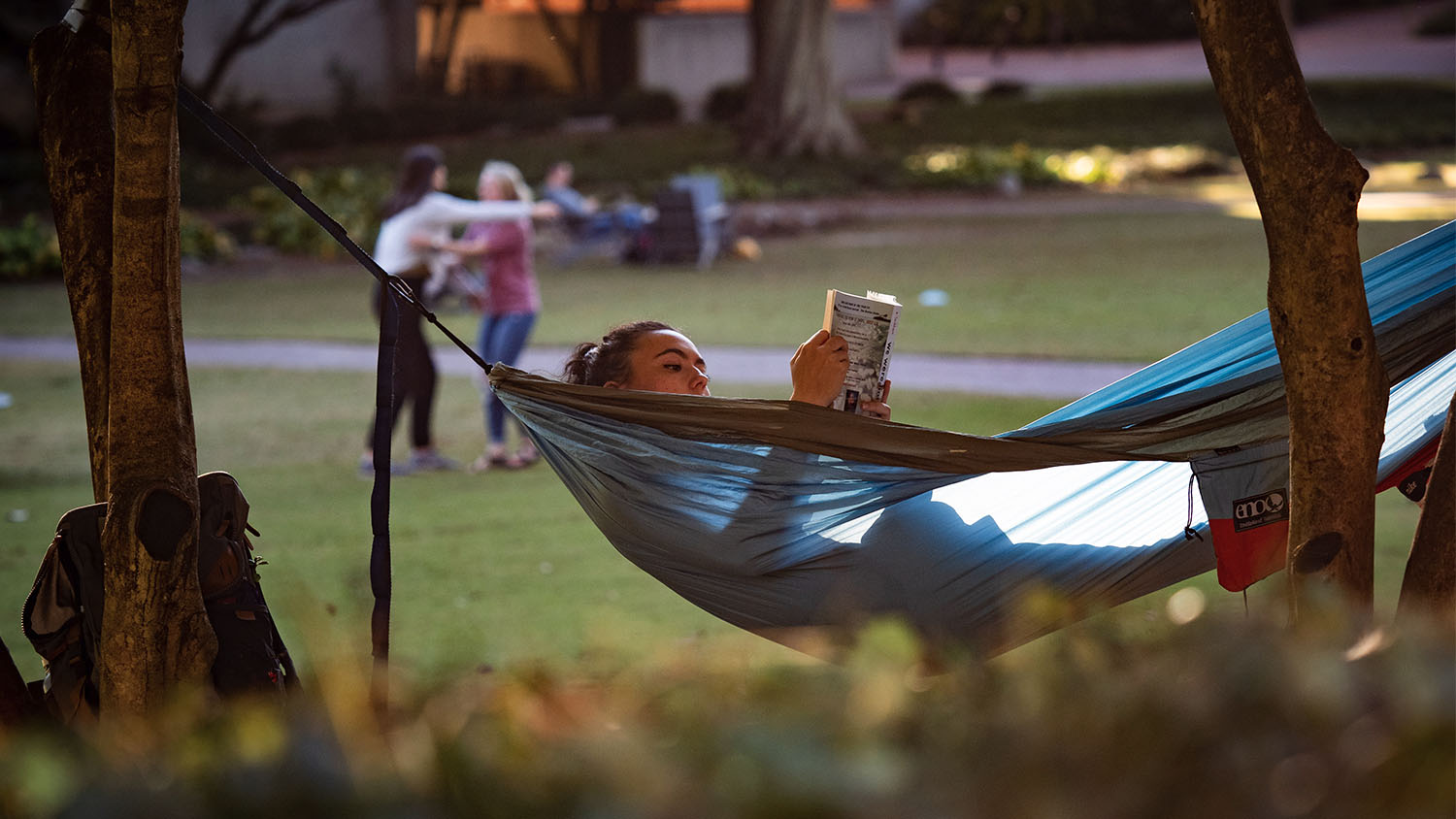 Student resting in hammock
